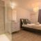 Appartements ATYPIQUE - 2 chambres avec salles de bains, cuisine equipee, parking gratuit : photos des chambres
