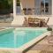 Villas Maison de vacances avec clim, piscine et parking : photos des chambres